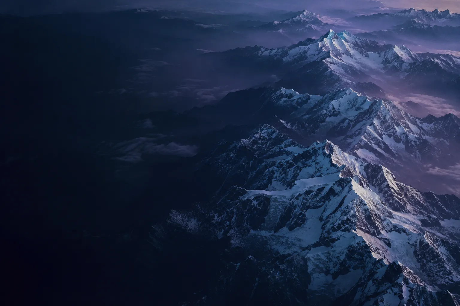 Himalayan ridges seen from above at blue hour